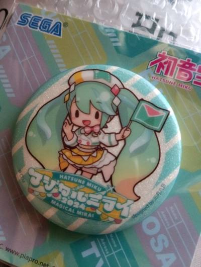 No damage/smudges whatsoever. 
Authentic badge from the magical mirai preorder flyer
from the event itself