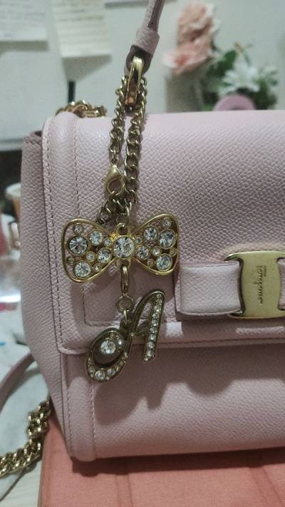 the coach bag is in good condition. the handmade keychains are well made and very beautiful! light stick is in good condition so I th...